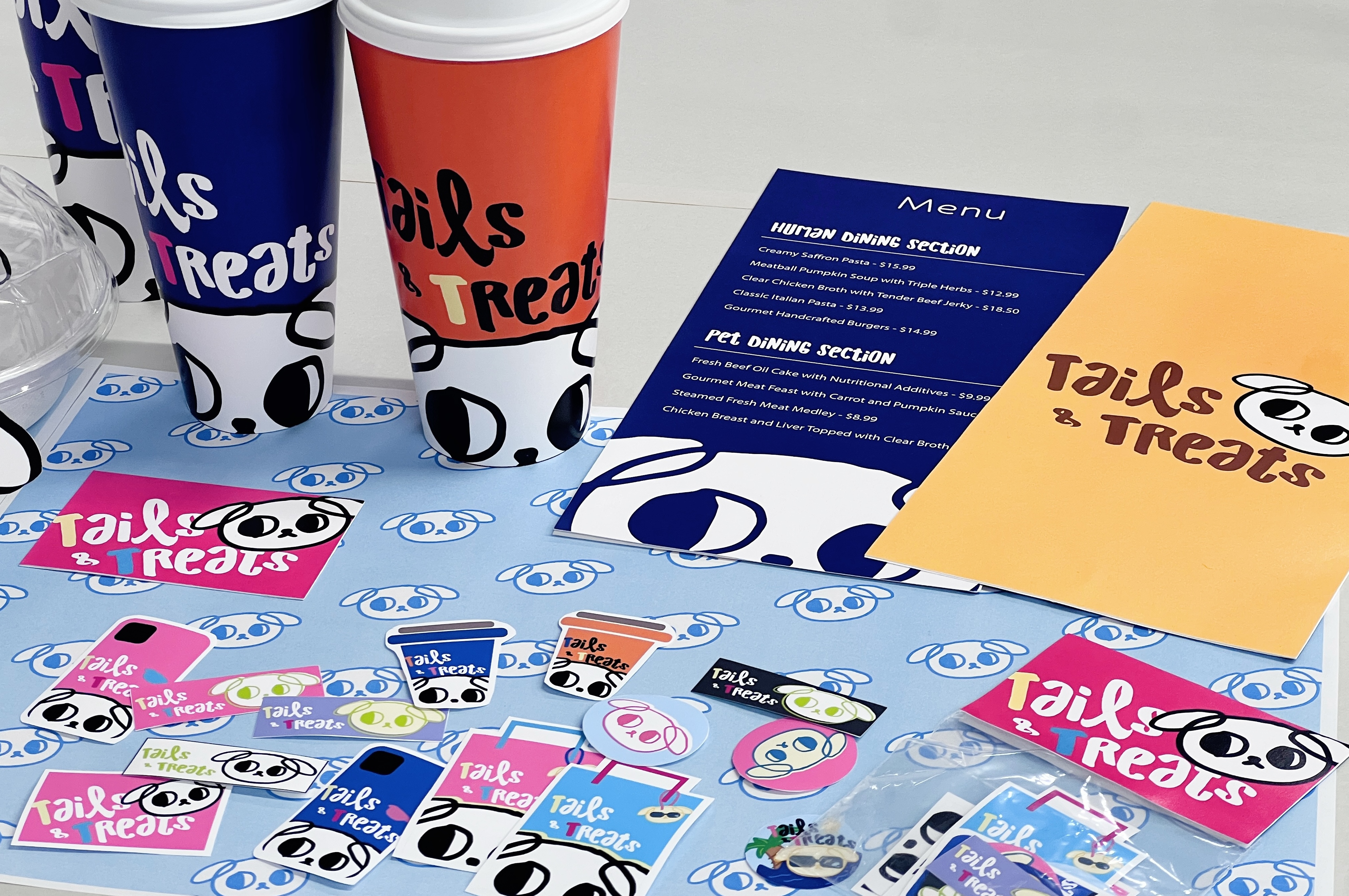 Tails and Treats final branded menu and merchandise spread